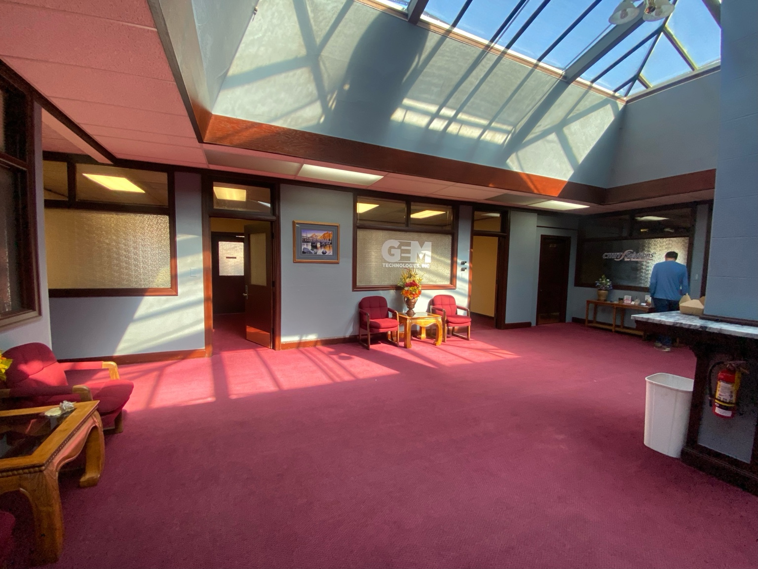 Skylit shared common area with seating